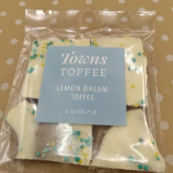 Packaged lemon dream toffee with a 'Towns Toffee' label on a polka dot background.